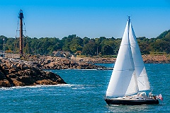 Sailboat Approaches Marblehead Light Over Rocky Shoreline